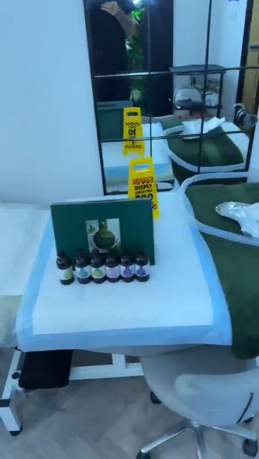 Treatment bed with a green velvet throw